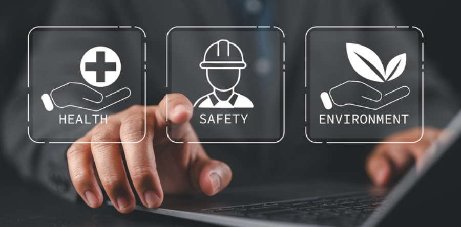 Businessman use laptop with virtual icons that say health, safety and environment